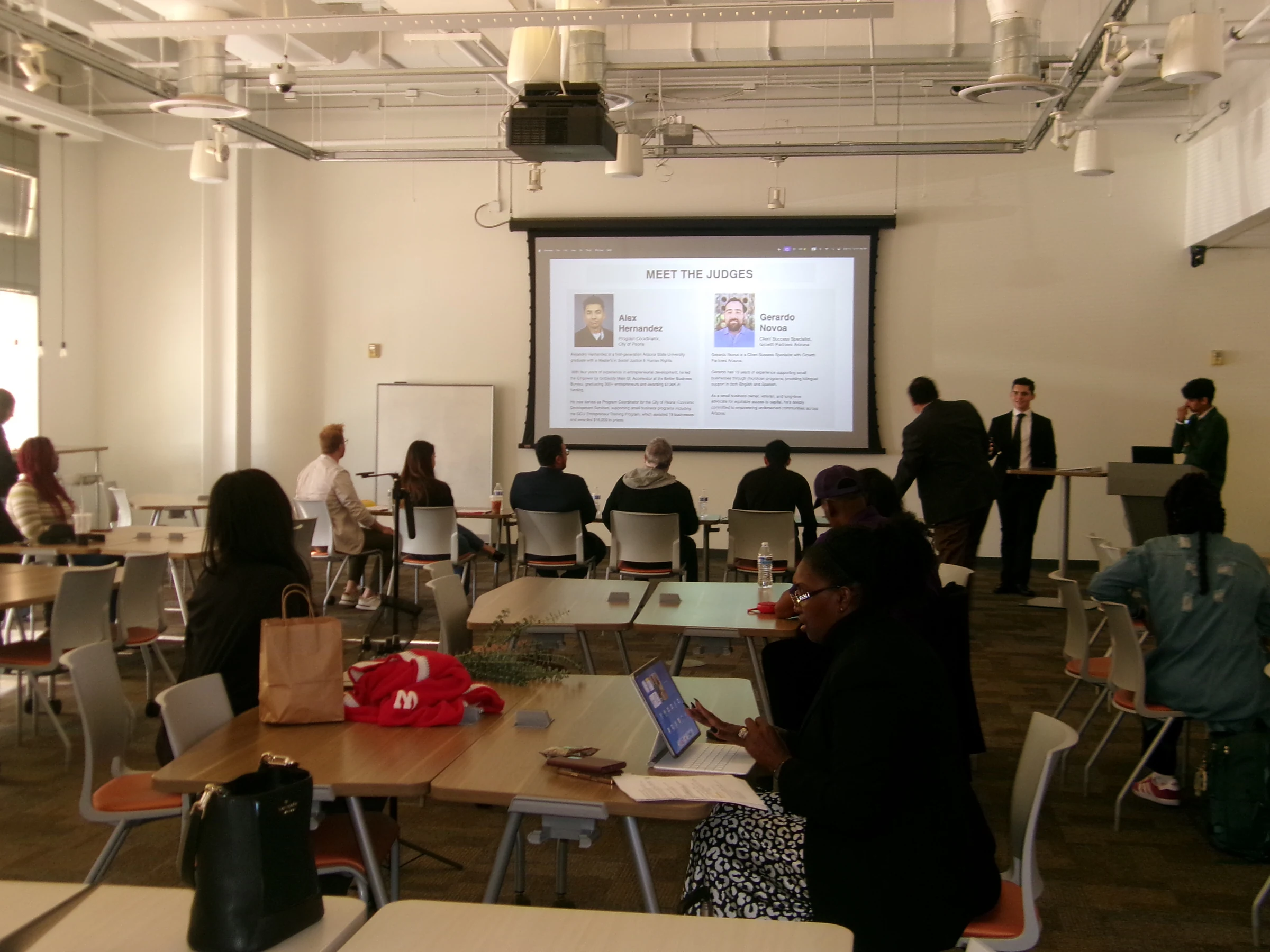 Community members and speakers gathered at AMI’s December 2025 pitch competition