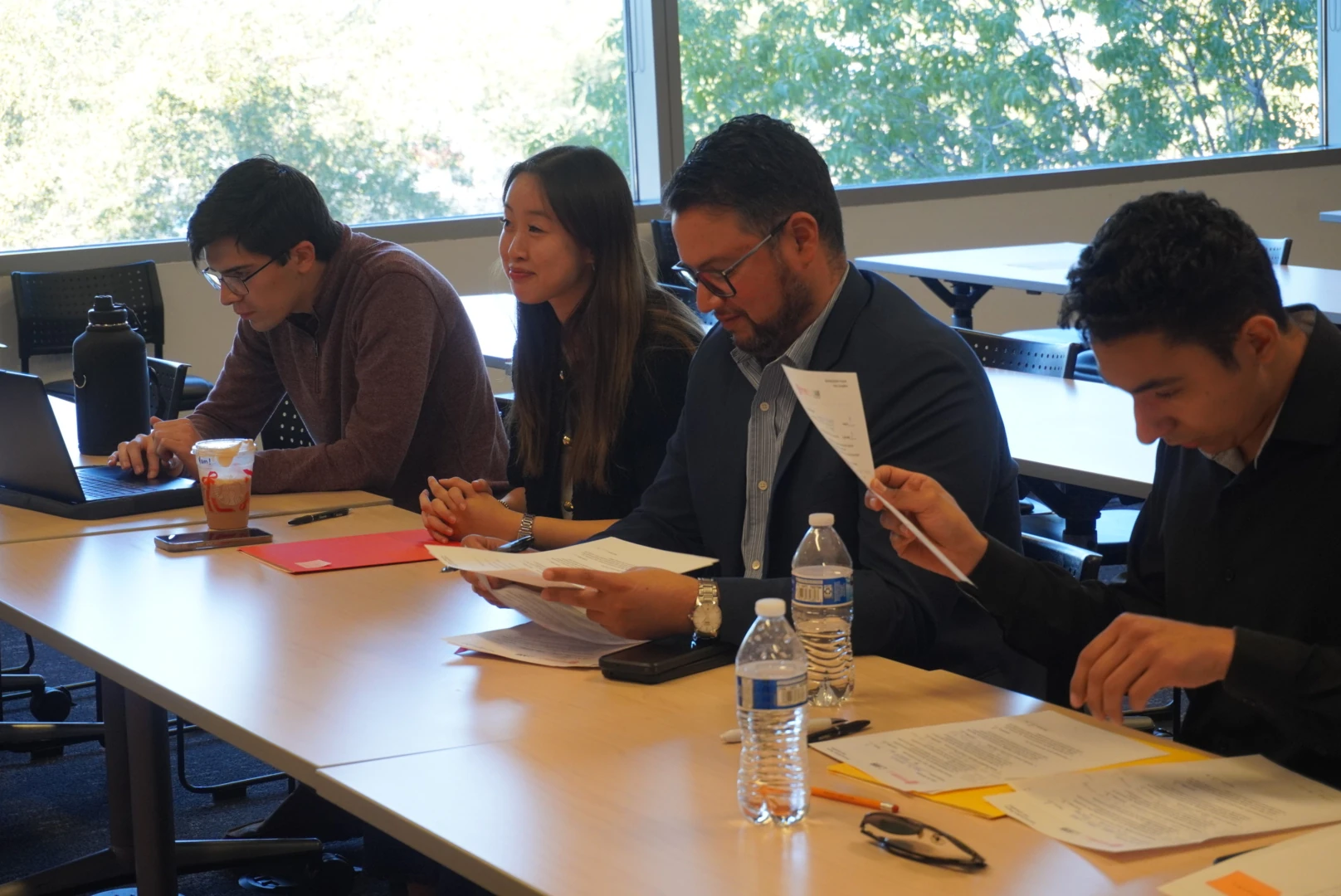 Panel members reviewing presentations at AMI’s December 2025 pitch competition