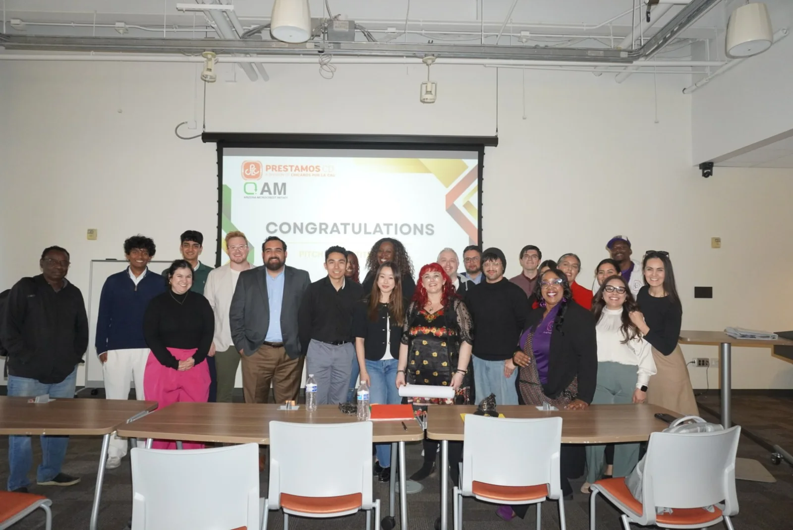 Entrepreneurs, guests, and AMI members gathered after a past pitch competition